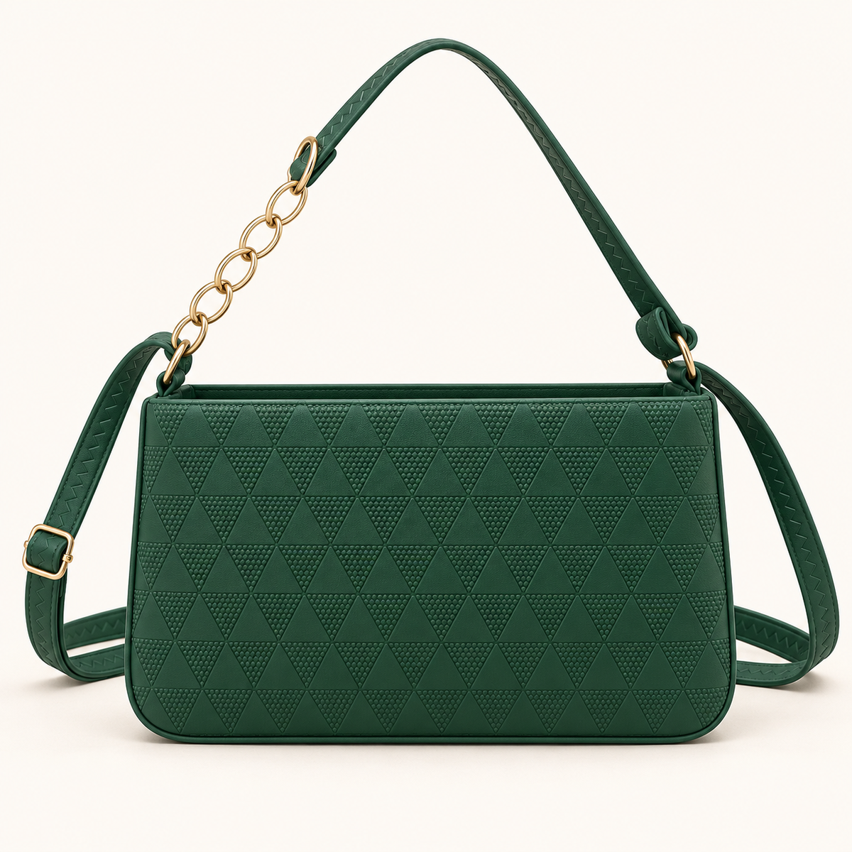 Straight-on view of a green shoulder bag with alternating triangle textures, a rectangular silhouette, gold-tone oval chain links and a long buckled strap.
