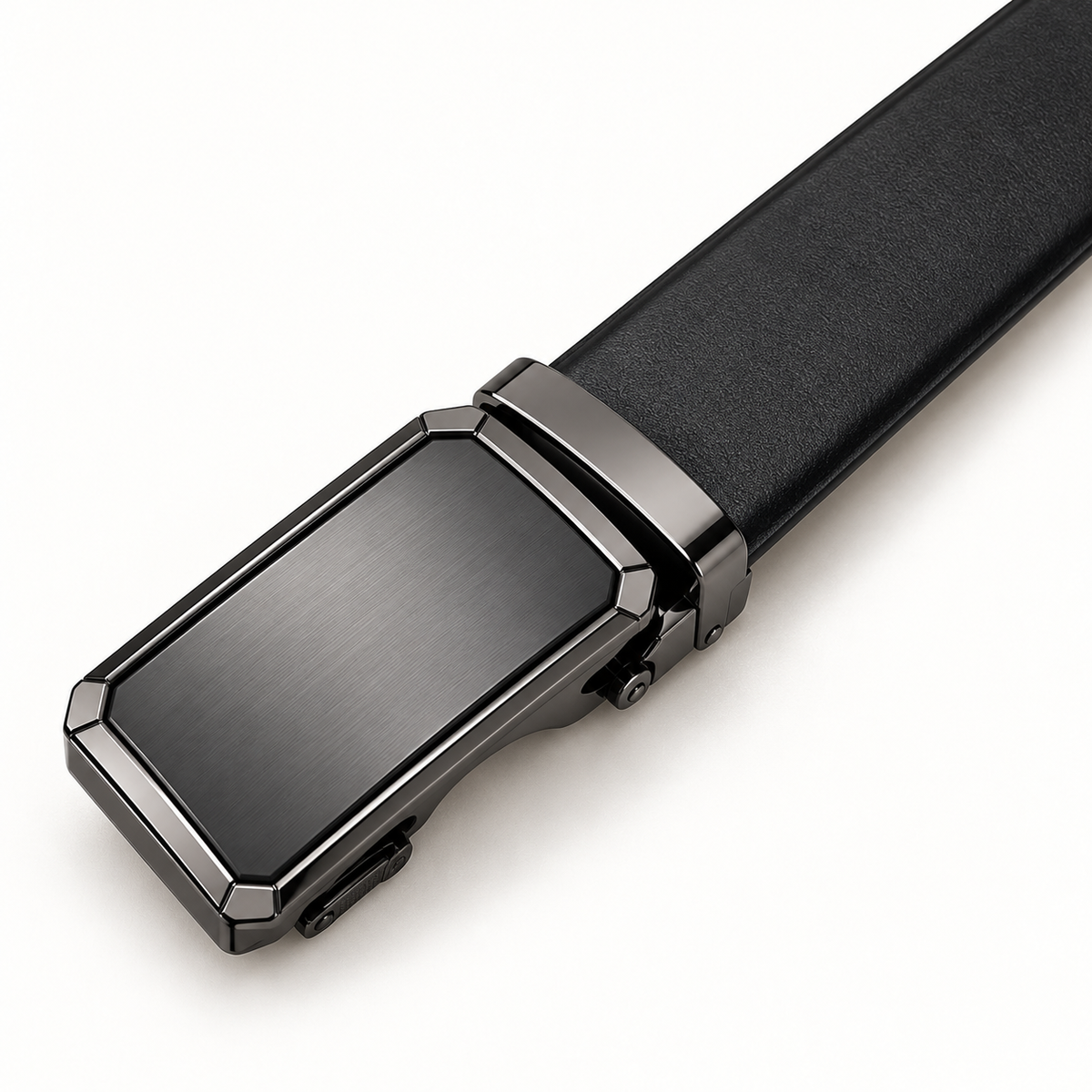 Close three-quarter detail of the plain rectangular automatic clamp buckle and adjoining black Leather strap on a warm-white background.