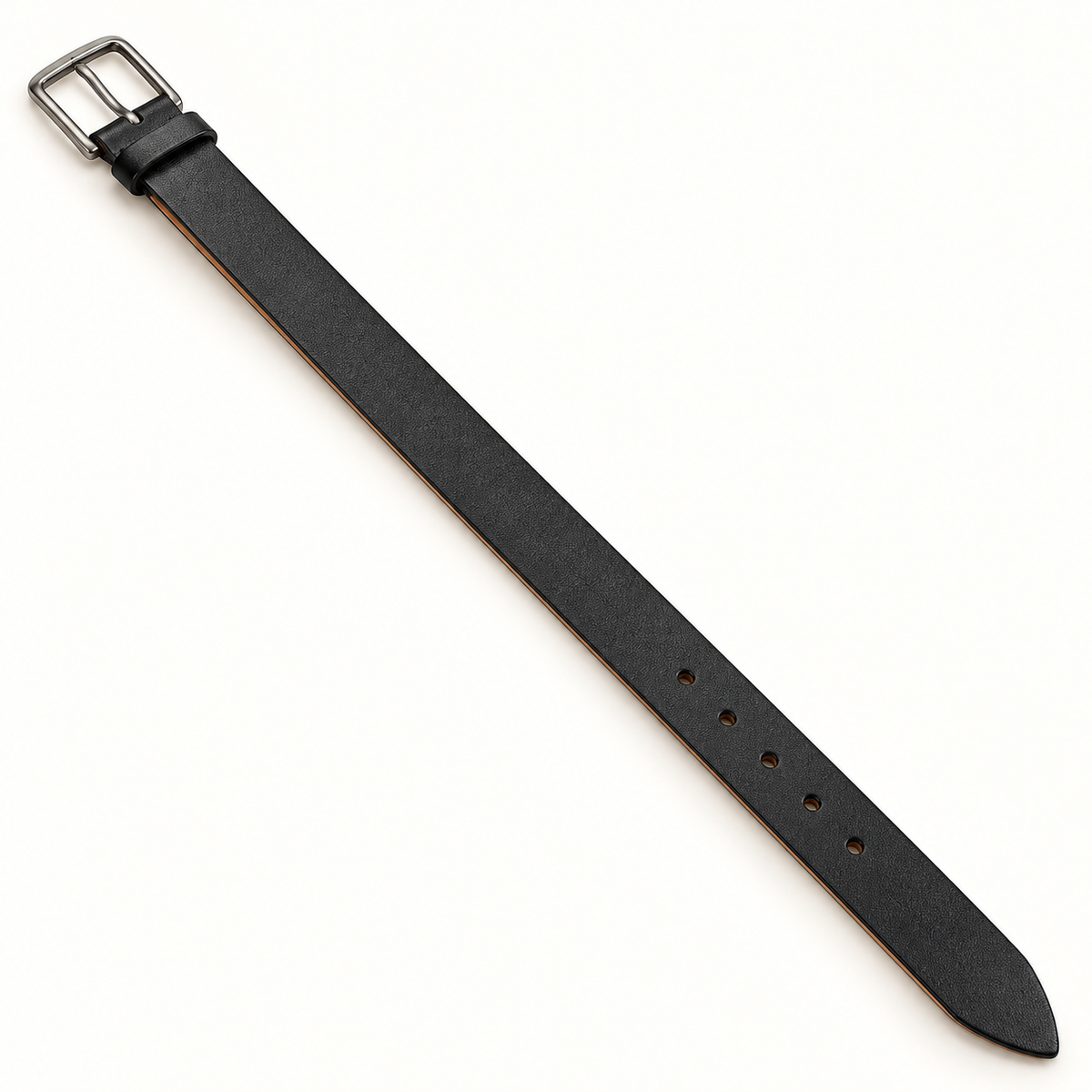 Men's black leather belt laid diagonally at full length, showing its lightly textured strap, plain rectangular silver-tone pin buckle, black keeper, round adjustment holes and pointed tip on a warm-white background.