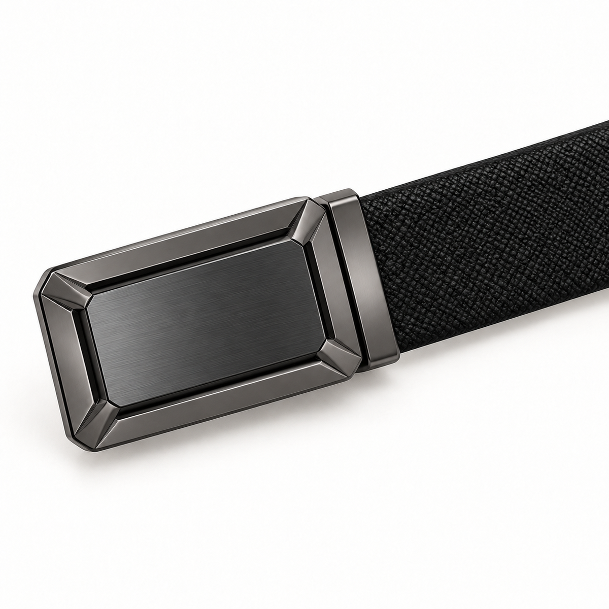 Close-up angled view of a black crosshatched belt and gunmetal-tone rectangular buckle, showing its brushed centre panel and polished bevelled frame.