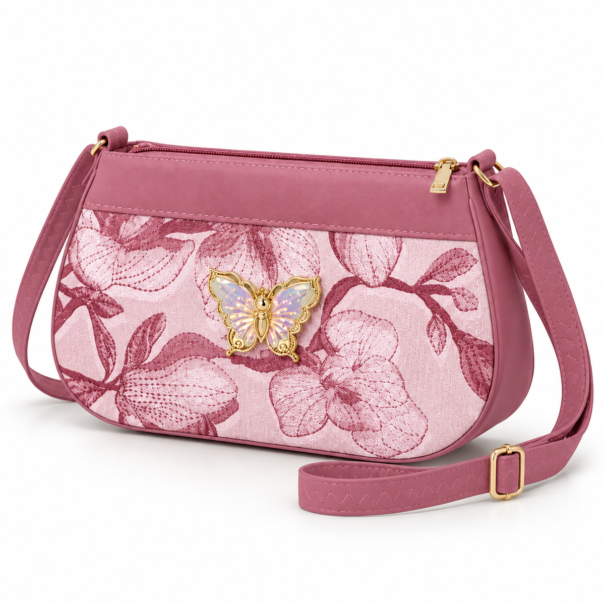 Dusty pink floral shoulder bag shown at an angle, with a pale iridescent butterfly, rounded lower corners, gold-tone zip pull and zigzag-stitched strap.
