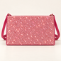 Front view of a hot pink rectangular women's sling bag with a sparkling glitter panel, matching shoulder strap and gold-tone strap rings on a plain light background