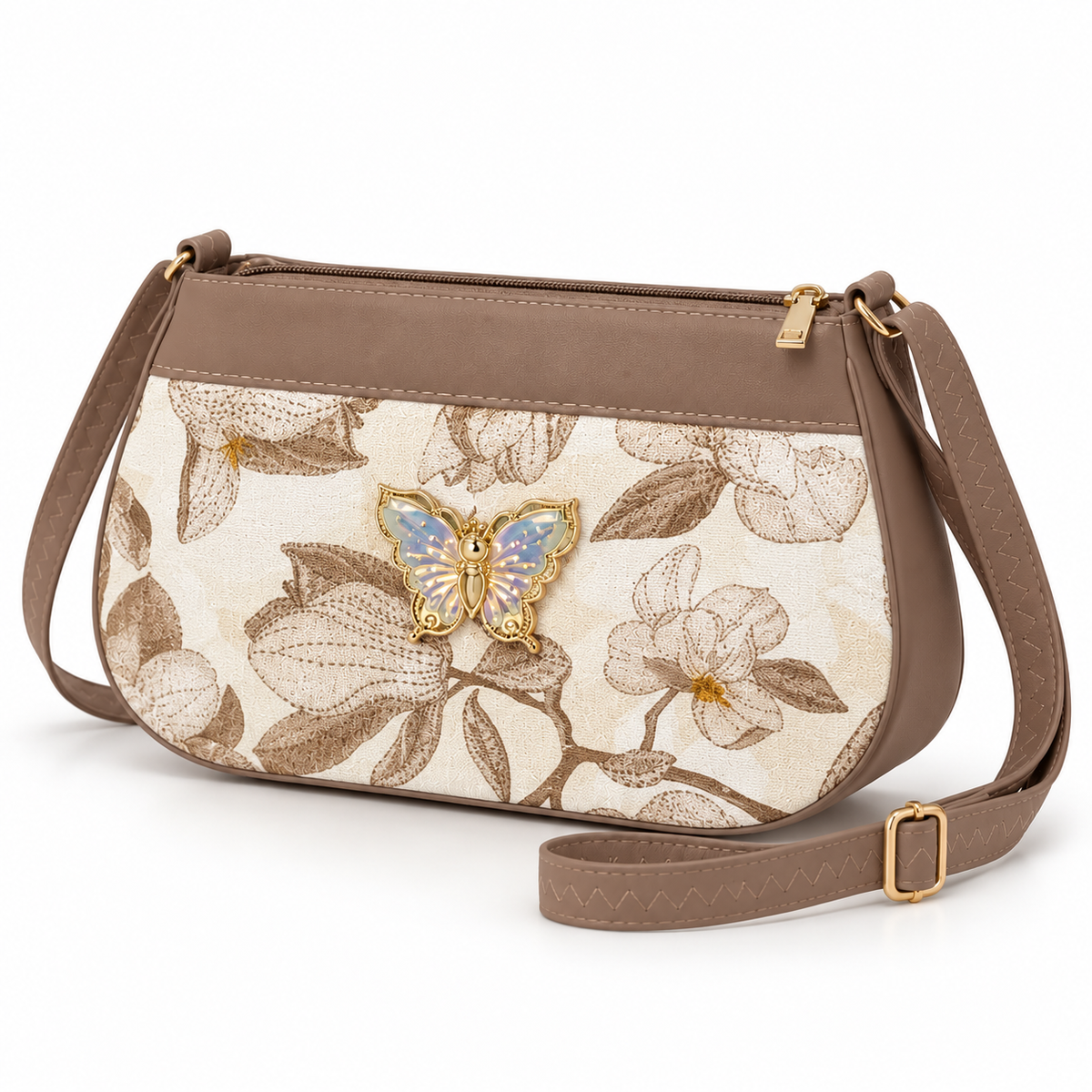 Cream and brown floral shoulder bag in three-quarter view with brown trim, a pale iridescent butterfly ornament, top zip and matching buckled strap.