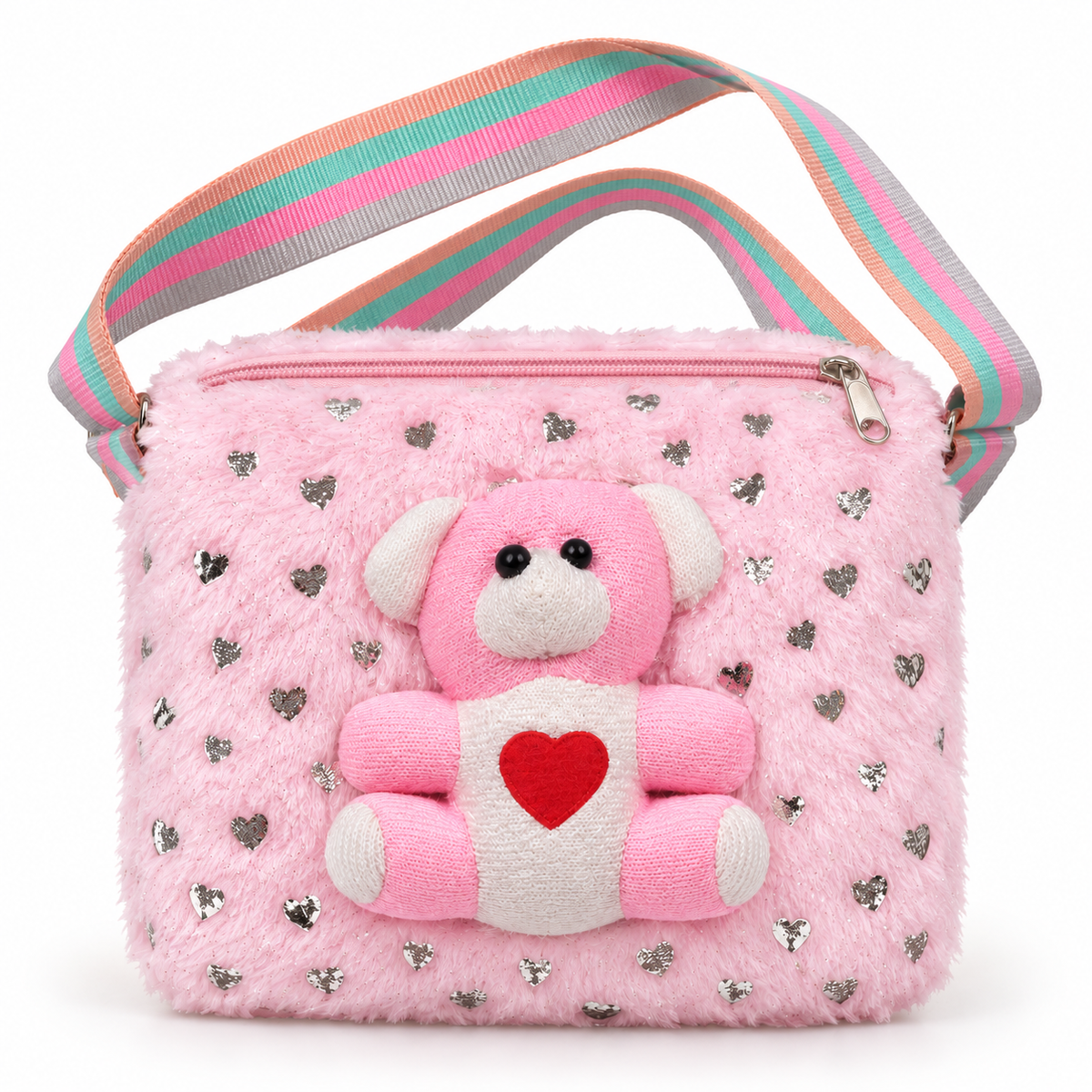 Pink shoulder bag in front view with a fluffy surface, scattered silver hearts, a raised pink and white teddy bear, pink zipper and striped strap.