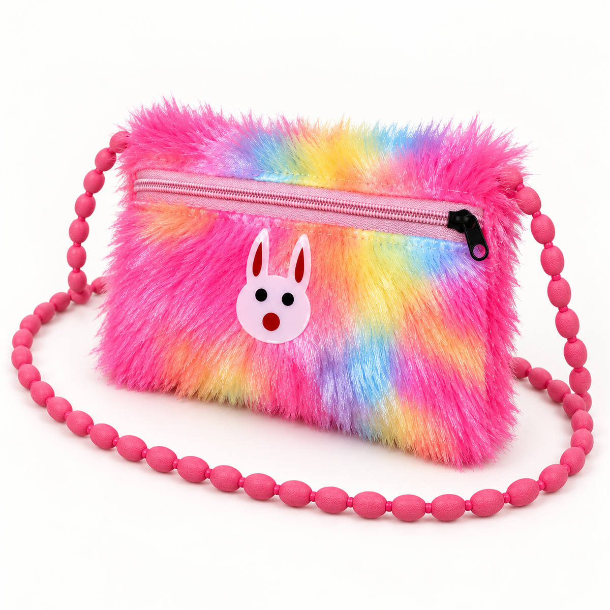 Pink rainbow shoulder pouch shown at an angle, featuring yellow, blue and purple patches, a pale pink rabbit face, pink beaded strap and black zip pull.