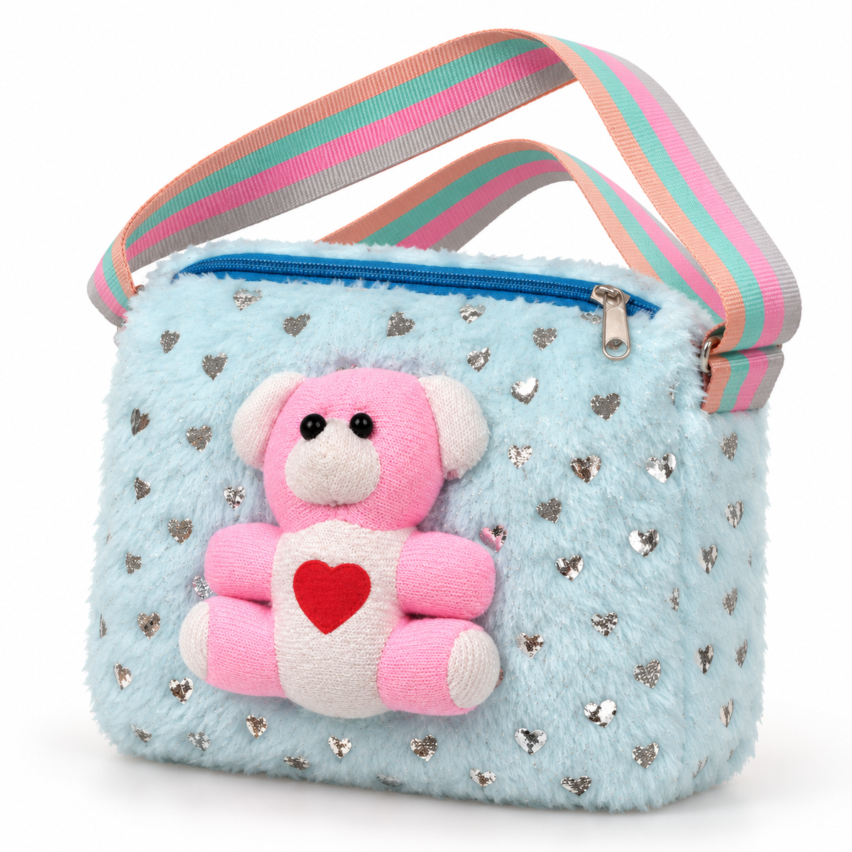 Light blue shoulder bag in three-quarter view, showing a fuzzy surface, silver hearts, pink teddy bear decoration, blue zipper and striped strap.