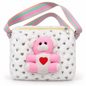 White fuzzy shoulder bag in front view with silver heart motifs, a pink and white teddy bear decoration, pale yellow zipper and pastel striped strap.